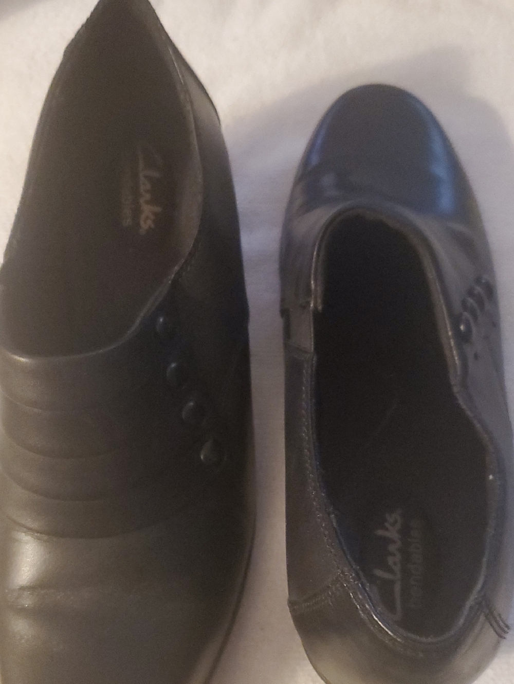 Clarks Black Leather Comfort Slip-Ons with Button Detail